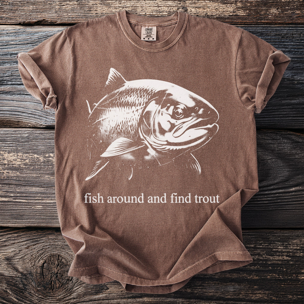 Brown t-shirt with white fish graphic and "fish around and find trout" text.