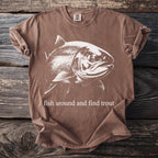 Brown t-shirt with white fish graphic and "fish around and find trout" text.