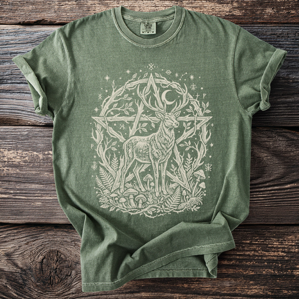 Green t-shirt with a white illustration of a deer and a pentagram surrounded by nature elements.