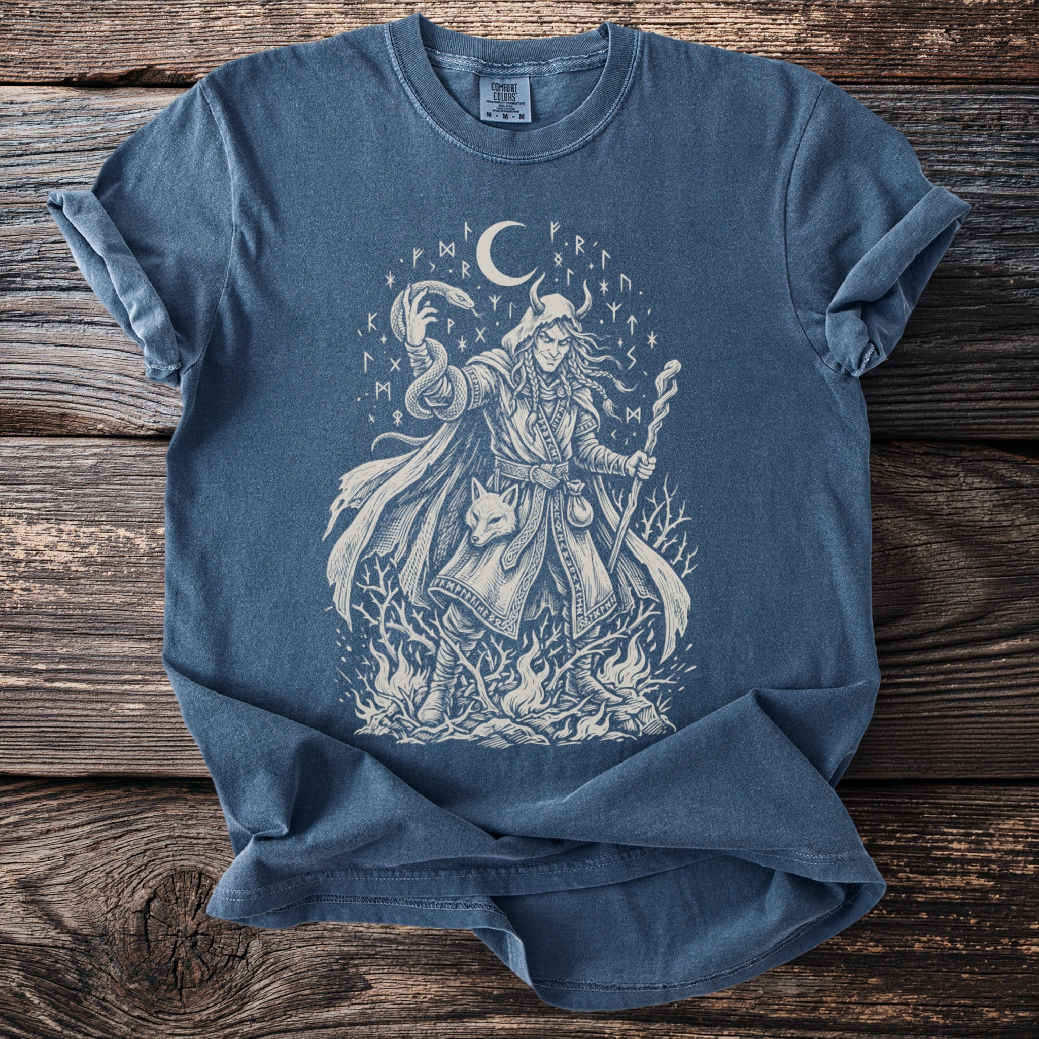 Blue t-shirt with a lunar, runic, and mystic shaman illustration.