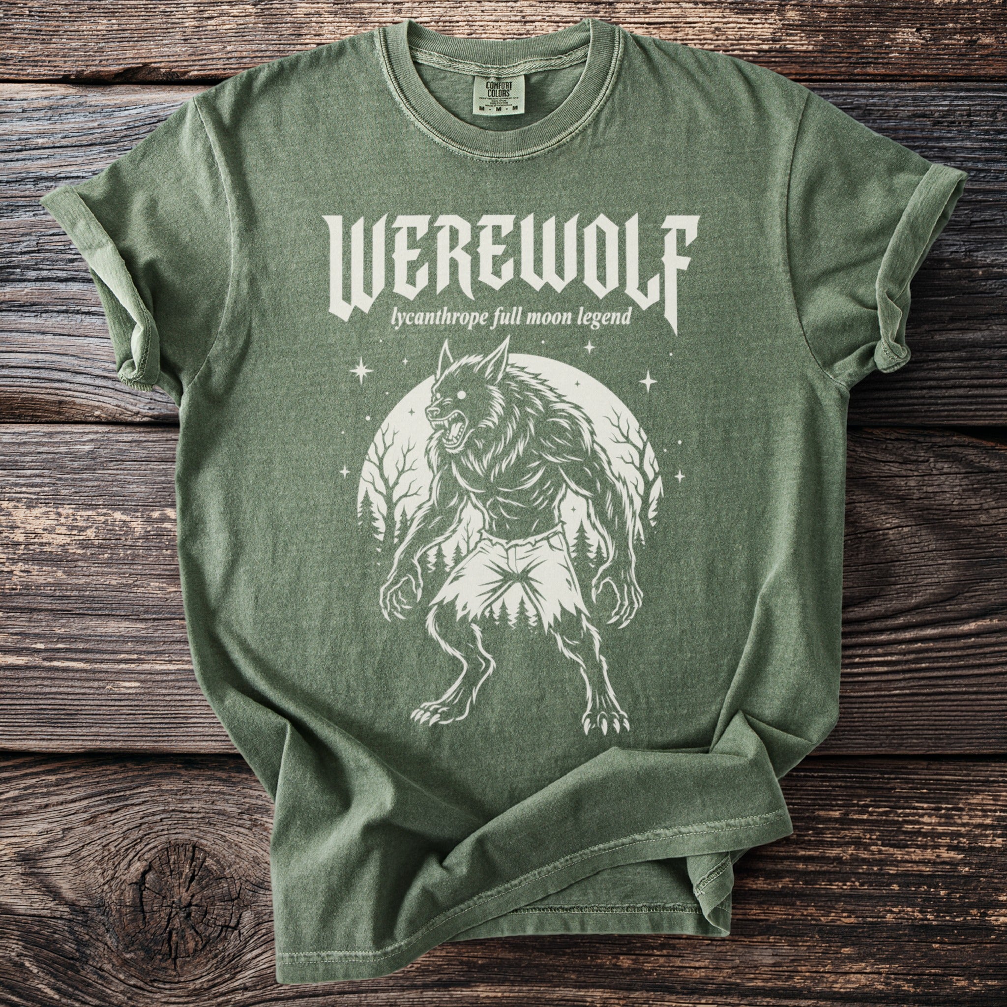 Green t-shirt with white werewolf graphic and text "Werewolf lycanthrope full moon legend".