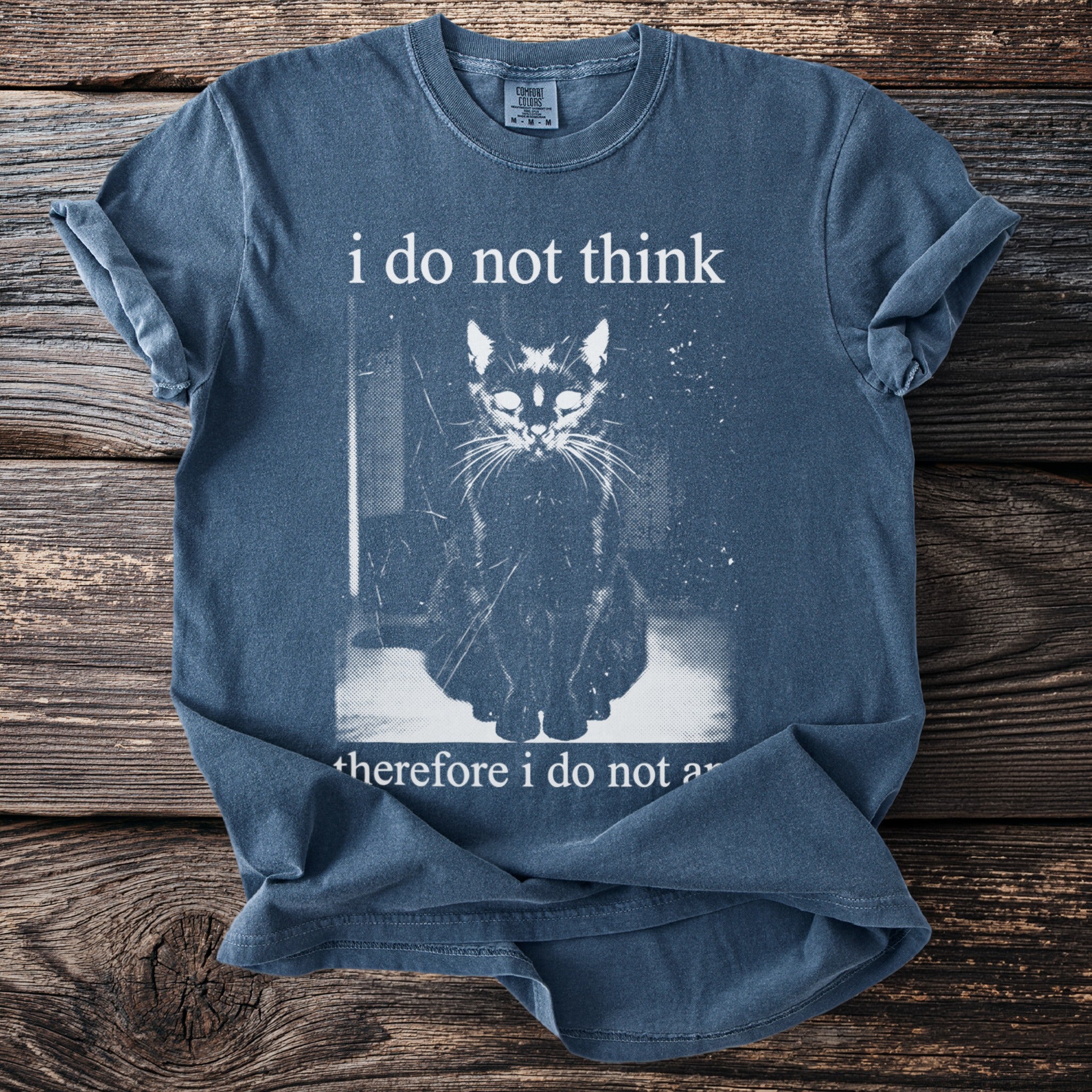 Blue t-shirt with distressed text "i do not think" above a sitting cat graphic.