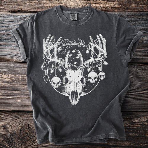 Dark t-shirt with white graphic of deer skull, antlers, skulls, and Christmas lights.
