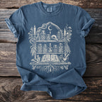 Blue Comfort Colors t-shirt with a white occult shelf graphic featuring a skull and jars.