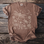 Brown t-shirt with white line art of dragonflies, flowers, and moon.