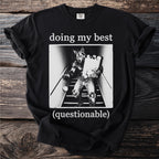 Black t-shirt with "doing my best (questionable)" text and werewolf graphic.
