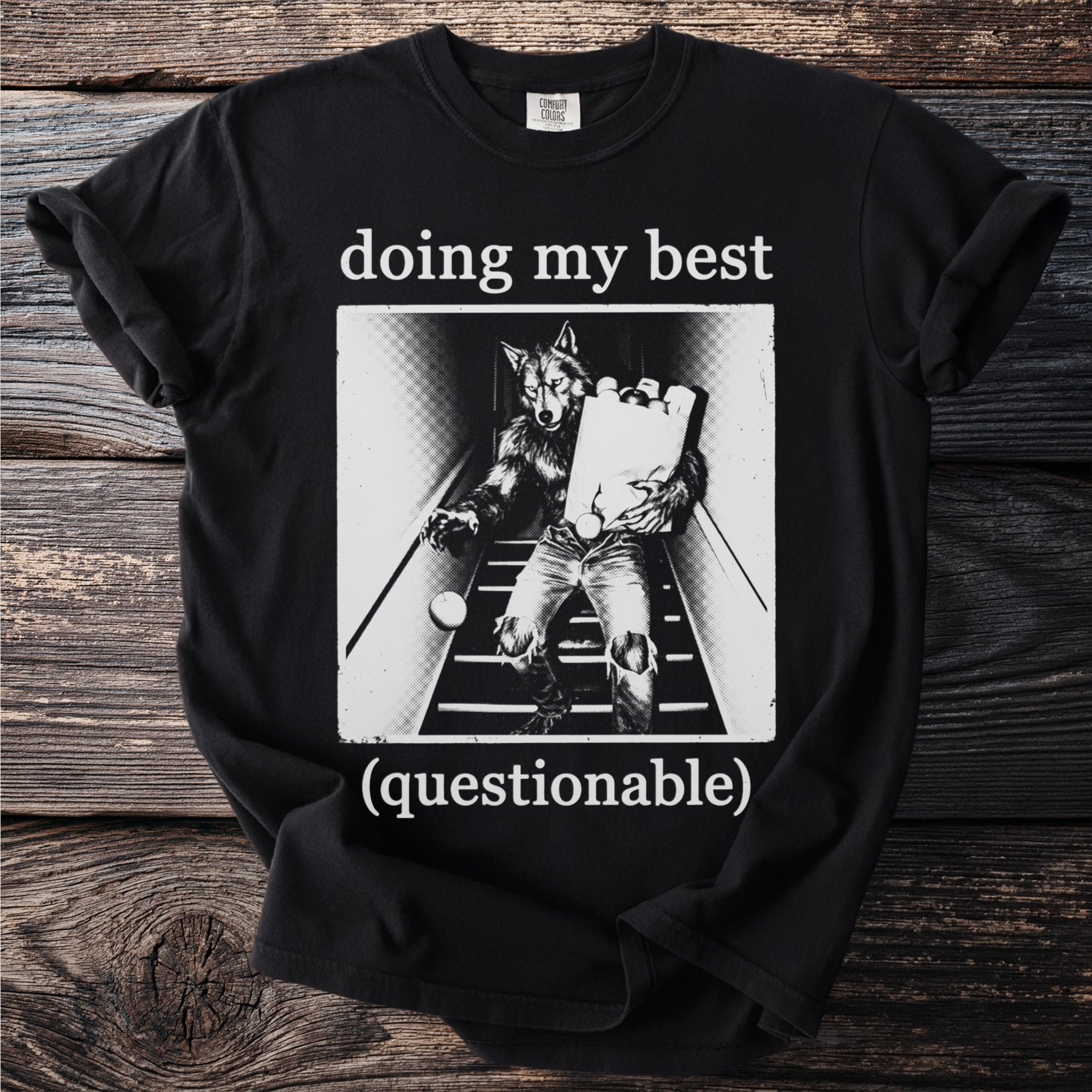 Black t-shirt with "doing my best (questionable)" text and werewolf graphic.