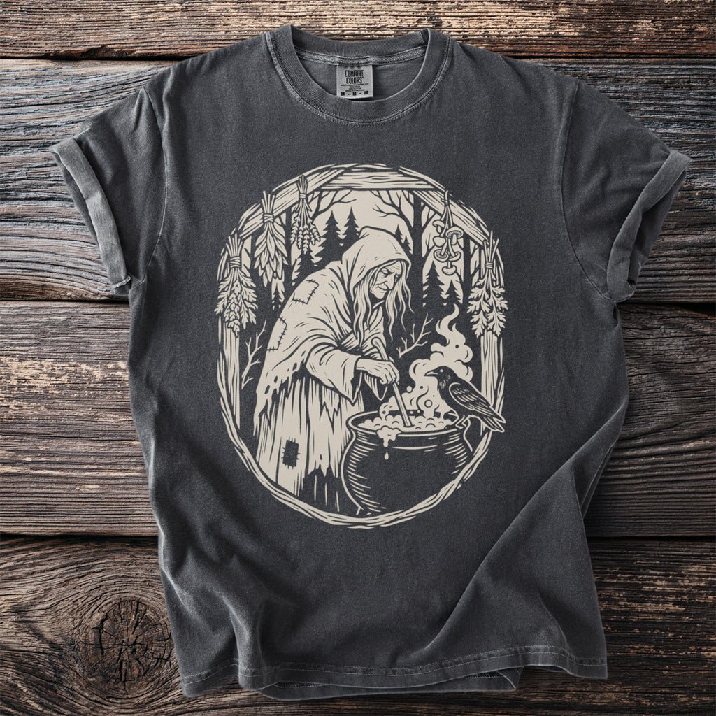 Witch stirring cauldron with raven in ornate forest border design.