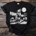 Black t-shirt with graphic of three possums near a trash can under a full moon.