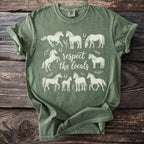 Green t-shirt with white horse illustrations and "respect the locals" text.
