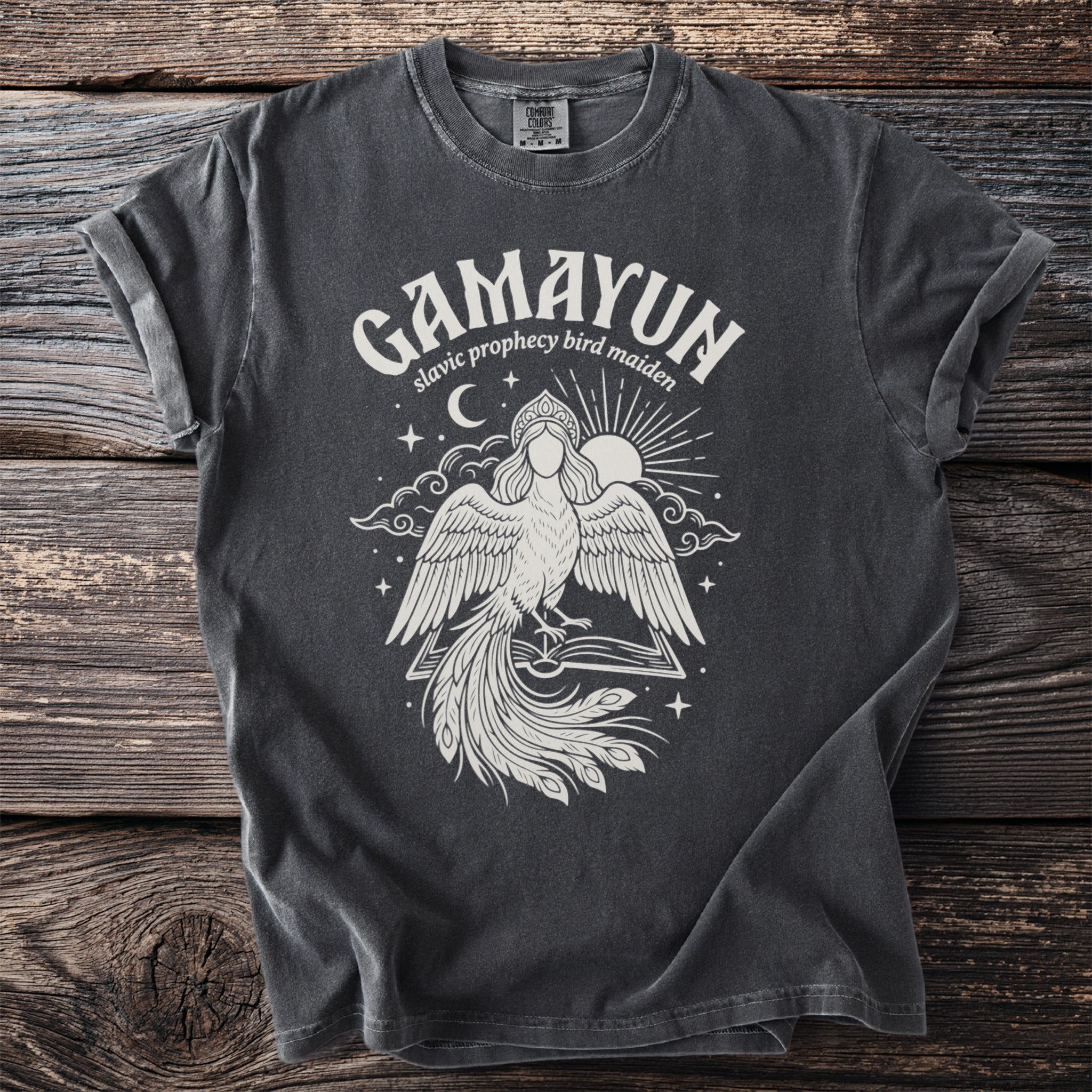Dark gray t-shirt with white "Gamayun" text and a Slavic prophecy bird maiden graphic.