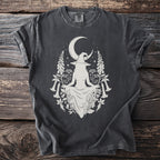 Dark gray t-shirt with a white line drawing of a witch and celestial floral elements.