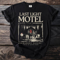 Black t-shirt with "Last Light Motel" and a spooky motel scene graphic.