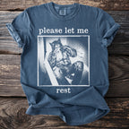 Blue t-shirt with werewolf illustration and text "please let me rest".