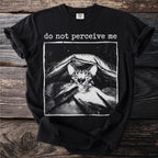 Black t-shirt with a graphic of a cat hiding under blankets and the text "do not perceive me".