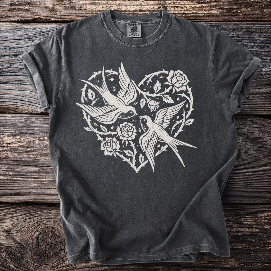 Gray t-shirt with white swallows and roses within a heart design.