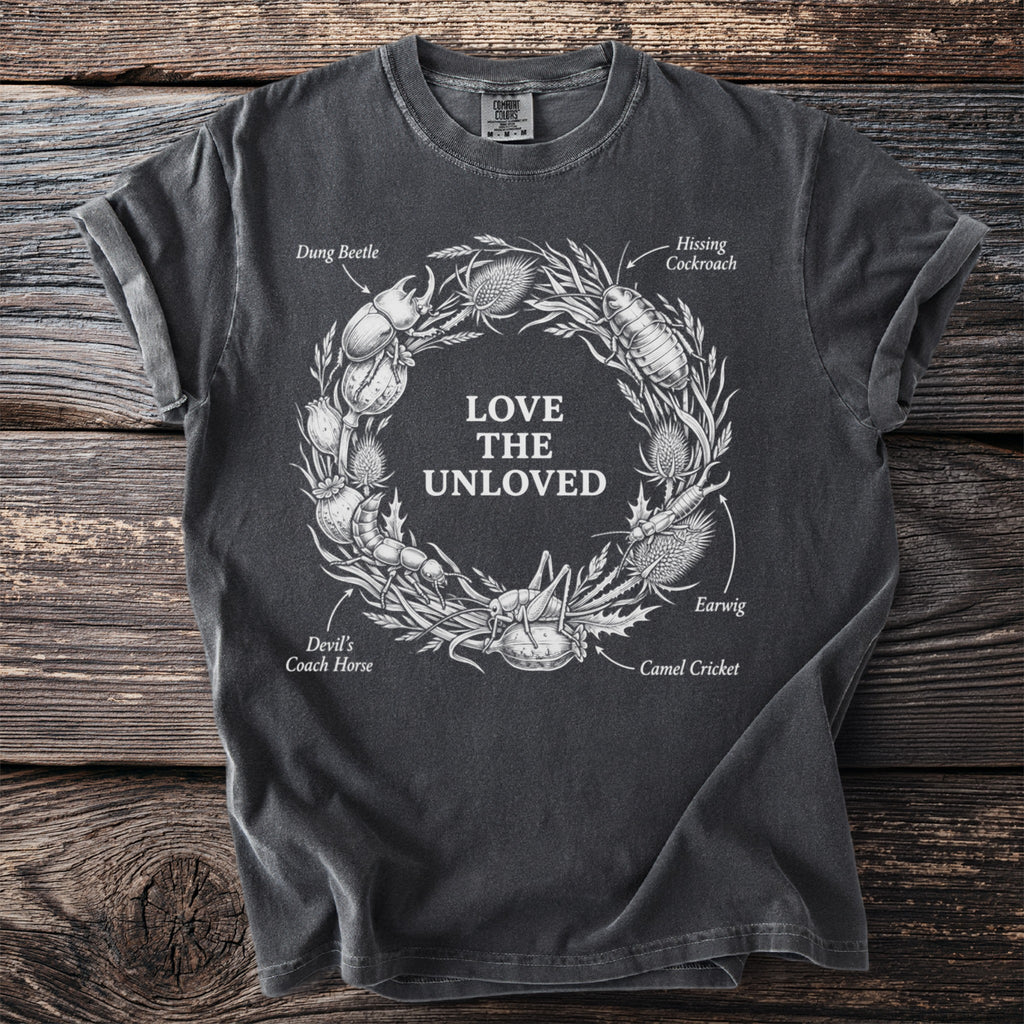 Dark grey t-shirt with "LOVE THE UNLOVED" surrounded by insects and thistles.