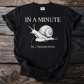 Black t-shirt with white graphic of a snail and text "IN A MINUTE Fig. 1: Estimated Arrival."