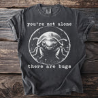 Dark grey t-shirt with a cartoon beetle and text "you're not alone there are bugs".