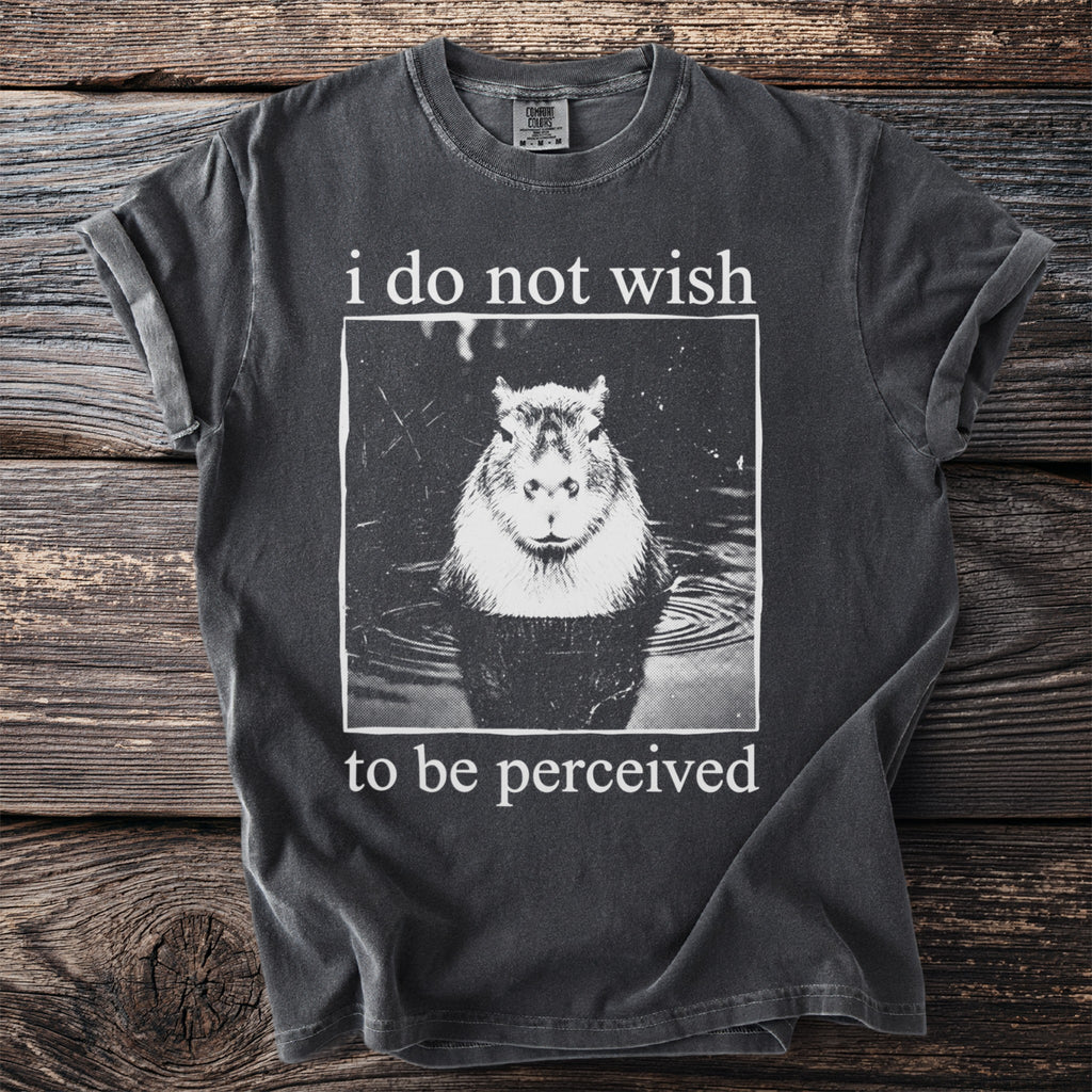 Dark gray t-shirt with a capybara in water and text "i do not wish to be perceived".