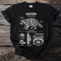 Black t-shirt with raccoon illustration detailing its features and habits.