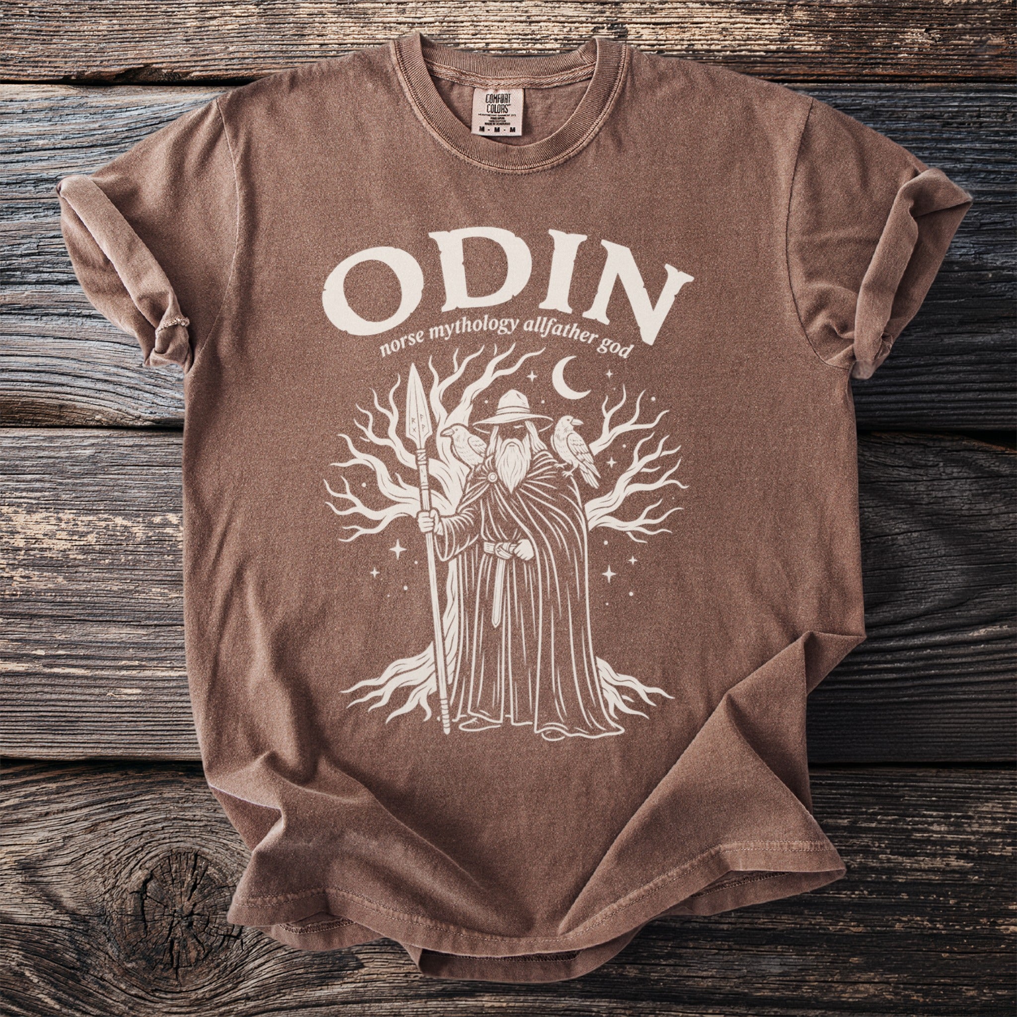 Brown t-shirt with print of Odin, ravens, and a tree, reading "ODIN norse mythology allfather god".