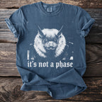 Blue t-shirt with distressed print of a bat face and the text "it's not a phase".