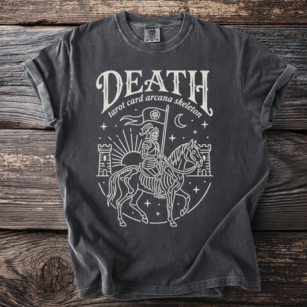 Dark gray t-shirt with white outline graphic of skeleton on horse, holding flag, with castles and sun.
