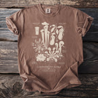 Brown t-shirt with a detailed illustration of carnivorous plants and labels.