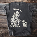 Grim Reaper reaching out to a cat on a dark gray t-shirt.