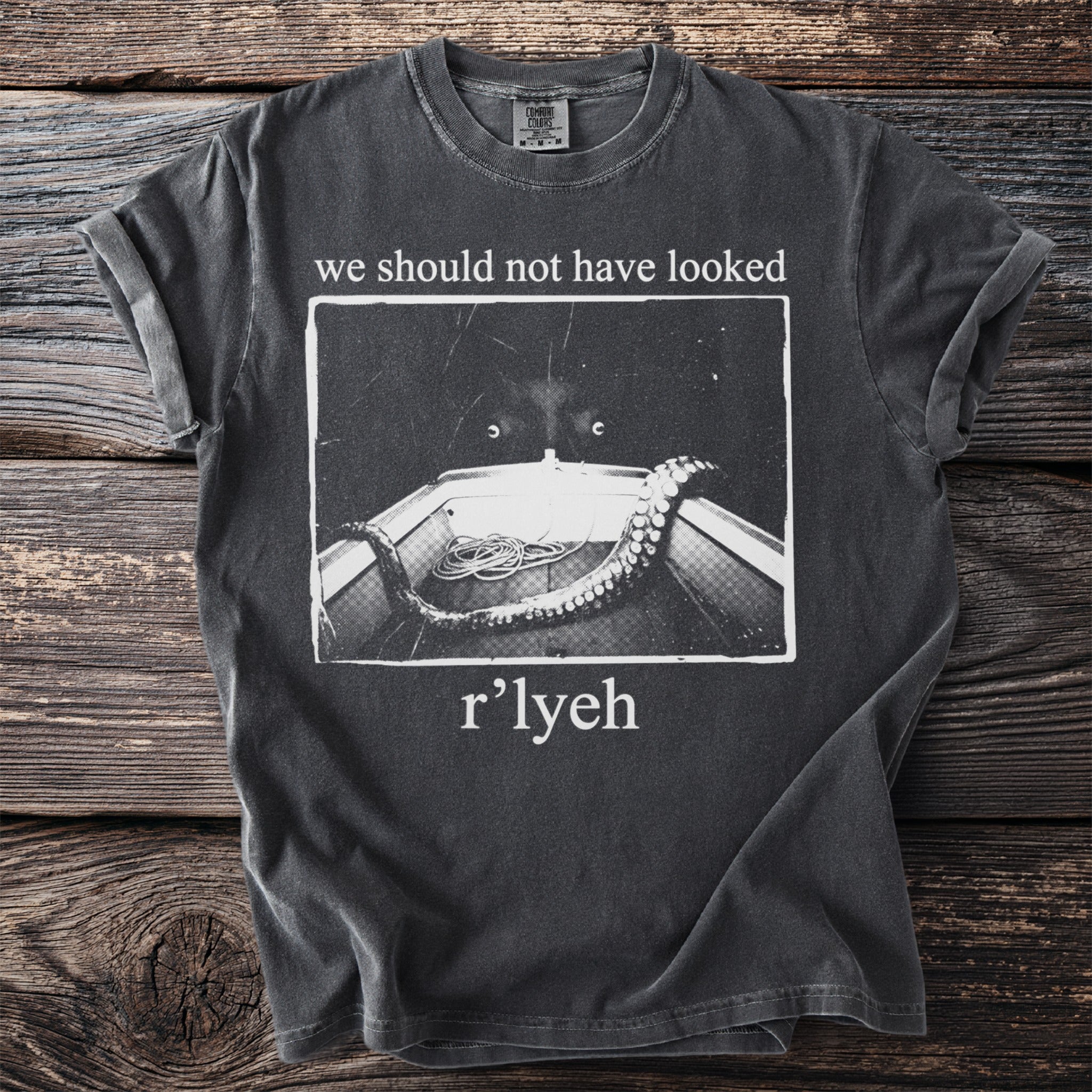 Dark grey t-shirt with "we should not have looked" and "r'lyeh" text and a Kraken-like image.