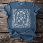 Blue t-shirt with white werewolf graphic in forest scene under a moon.