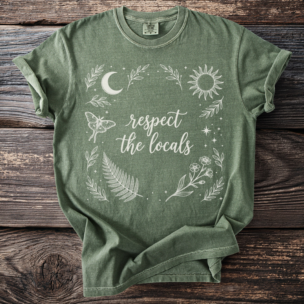 Heather sage green t-shirt with "respect the locals" text and nature graphic elements.