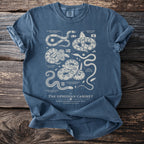 T-shirt design featuring "The Ophidian Cabinet" illustration of various snake species.