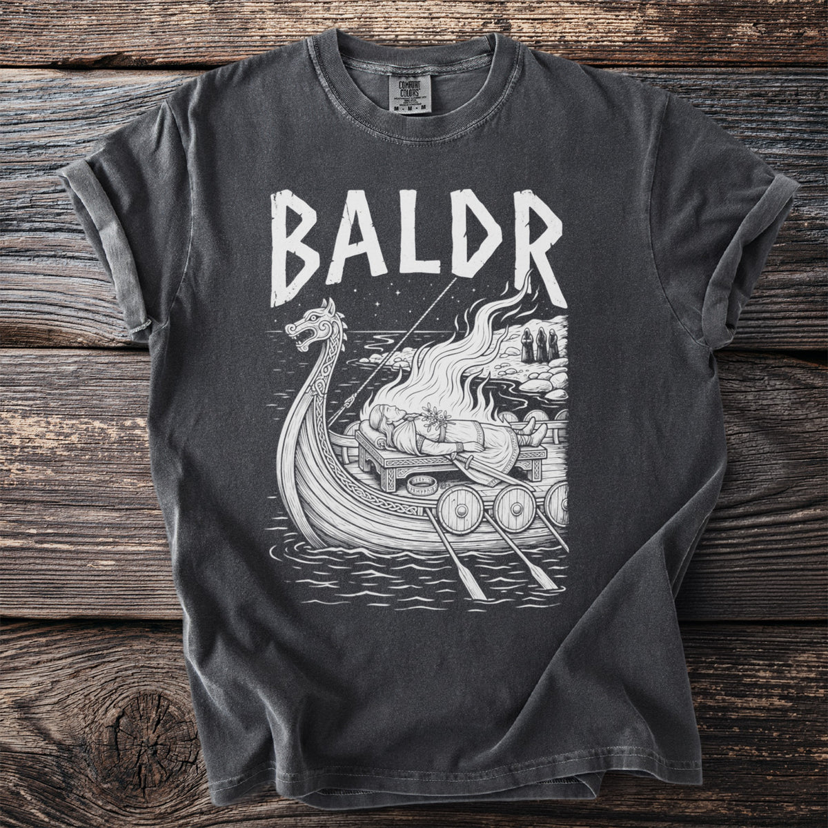T-shirt with "BALDR" text and Viking funeral scene on a longship.