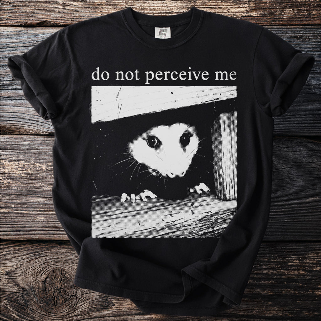 Black t-shirt with possum graphic and "do not perceive me" text.