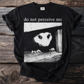 Black t-shirt with possum graphic and "do not perceive me" text.