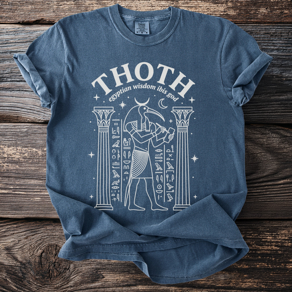 T-shirt with white line art of Thoth, Egyptian ibis god, between columns.