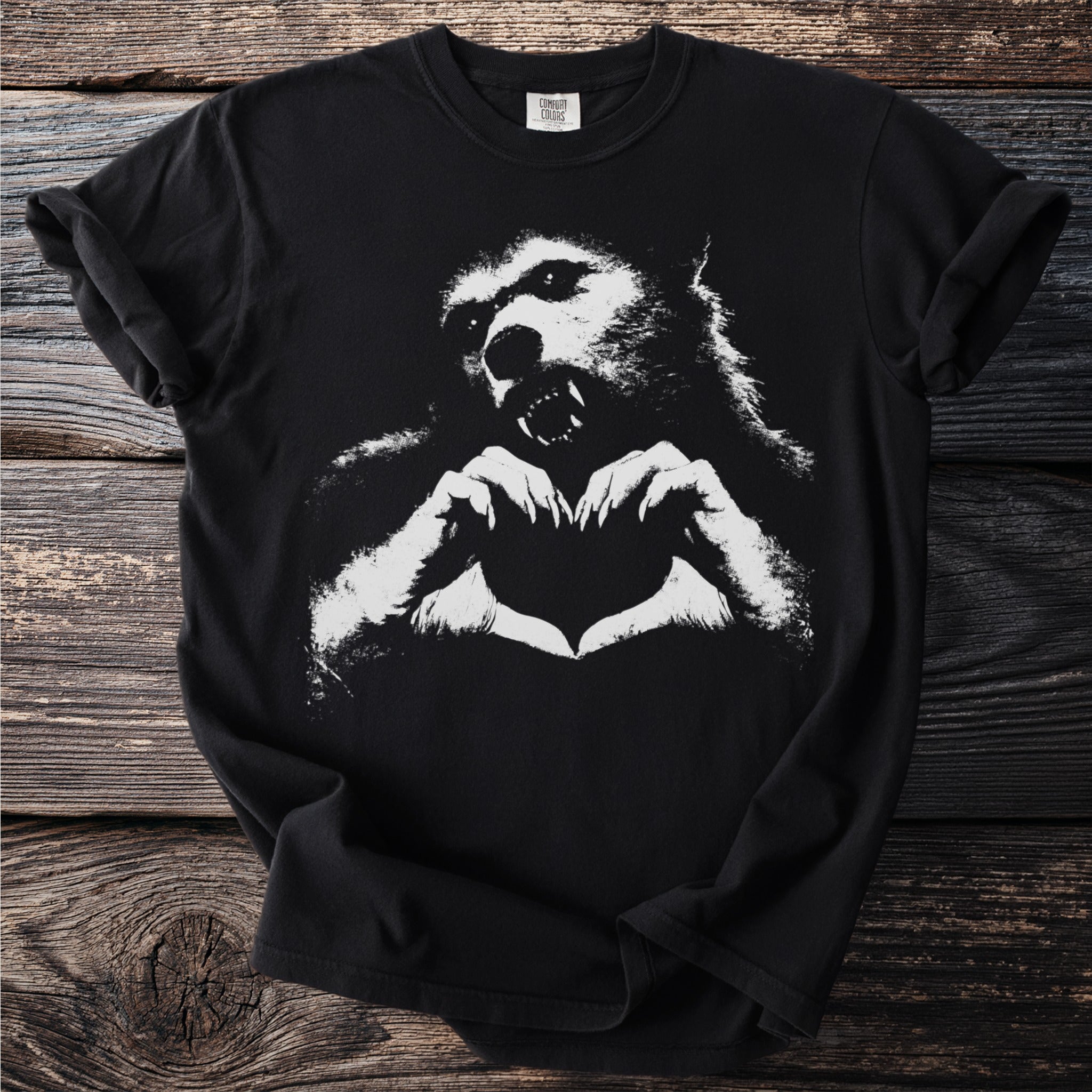 Black t-shirt with white graphic of a werewolf making a heart shape.