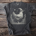 T-shirt with a witch chicken wearing a hat surrounded by plants and stars.