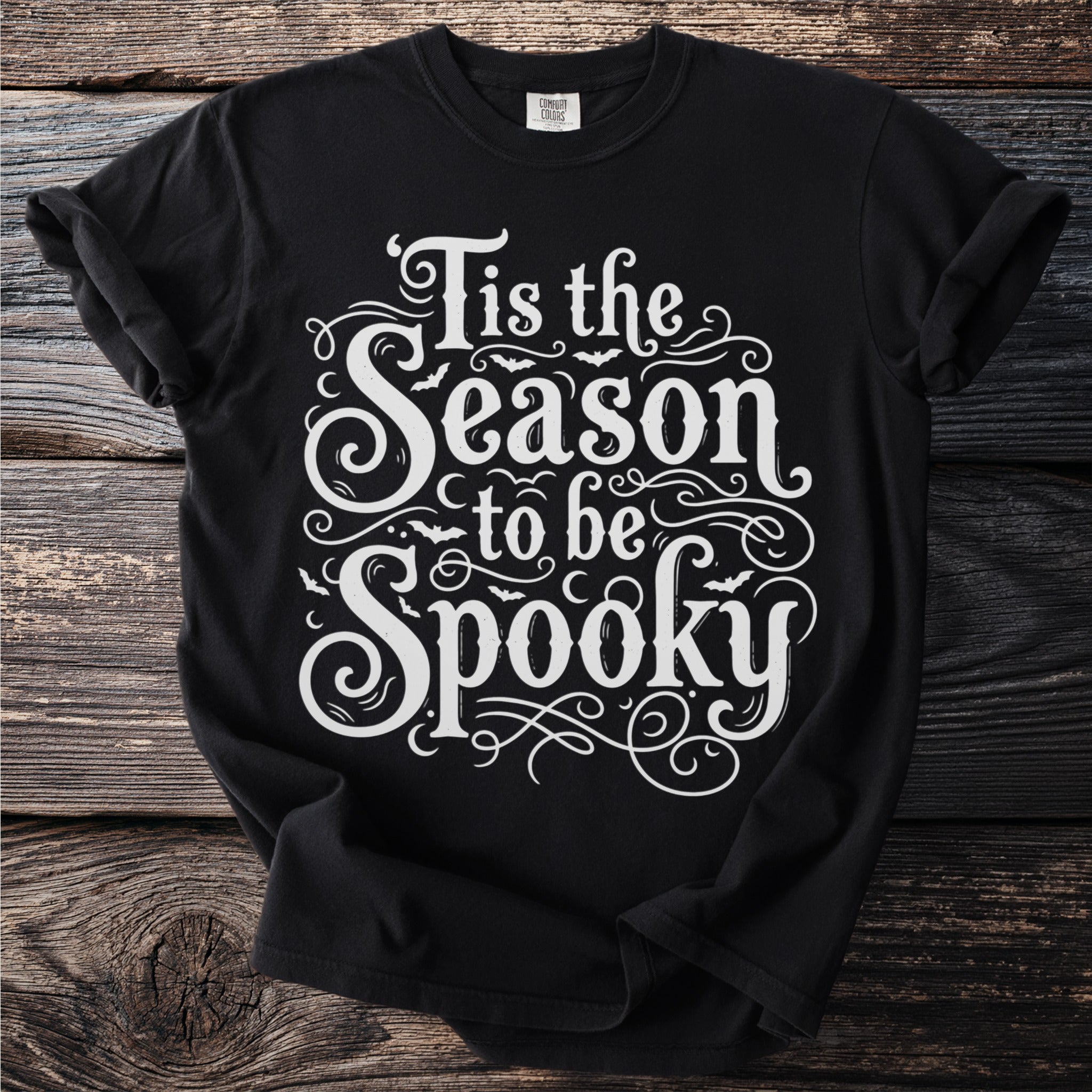 Black t-shirt with white text "Tis the Season to be Spooky" and bats.