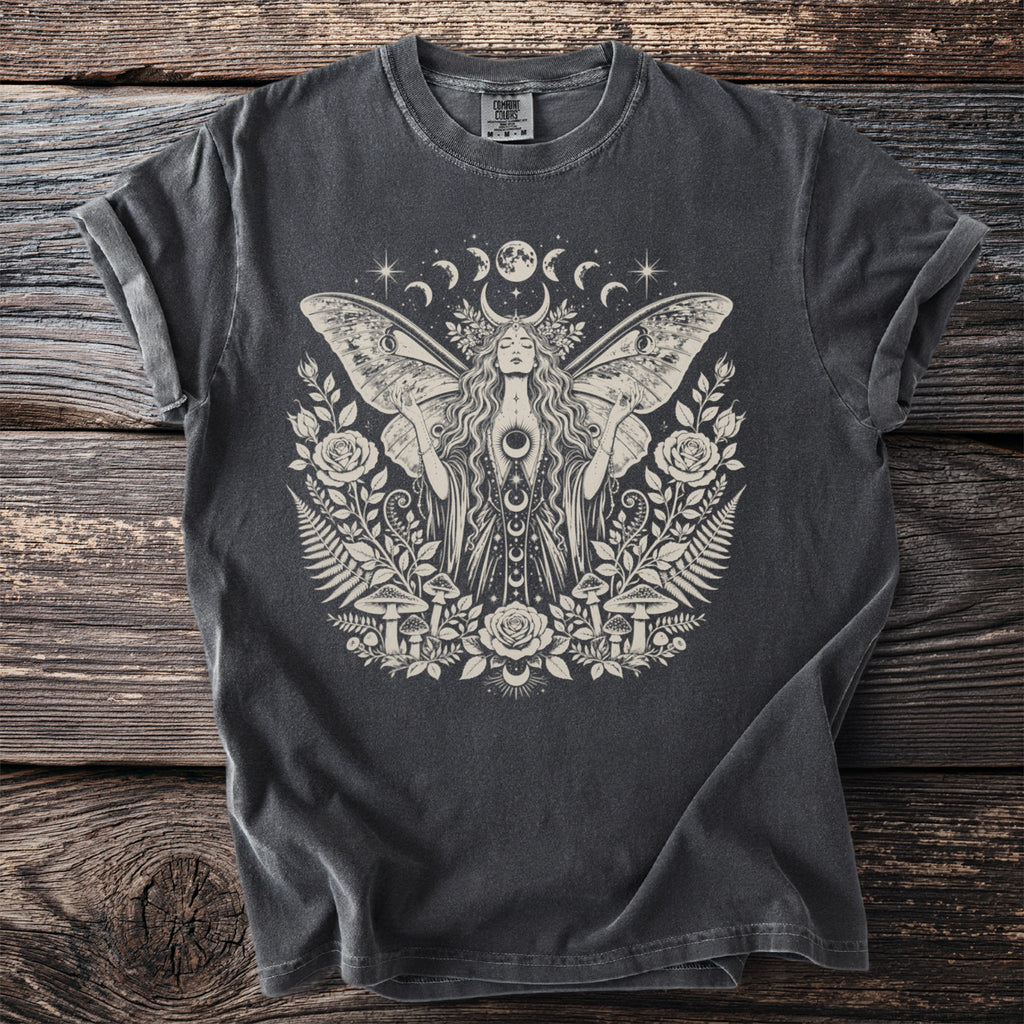 Dark grey t-shirt with a cream graphic of a moth woman surrounded by moons, roses, and mushrooms.