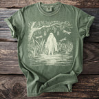 Ghost in marsh with dragonflies and hanging jars art on olive green t-shirt.