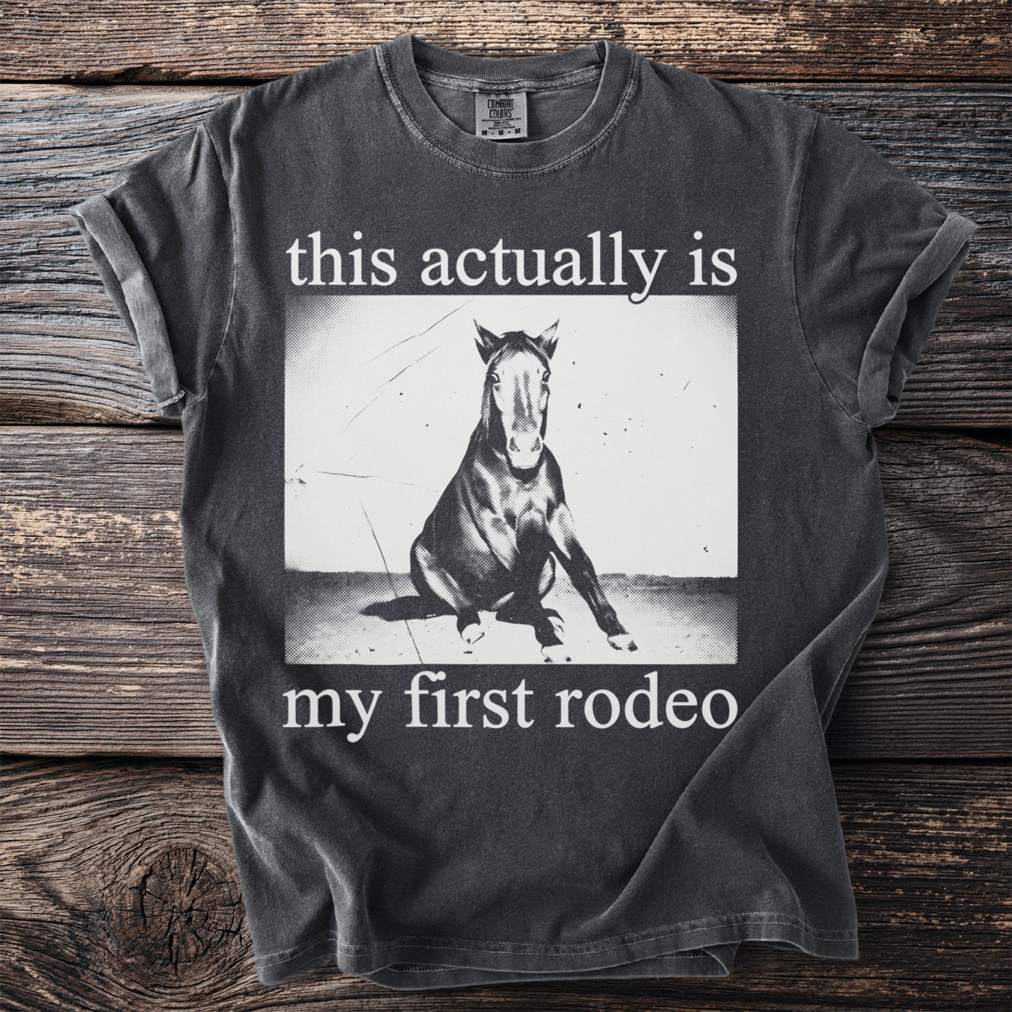 Dark grey t-shirt with horse and "this actually is my first rodeo" text.