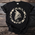 Black t-shirt with a howling wolf surrounded by moon phases and thorns.