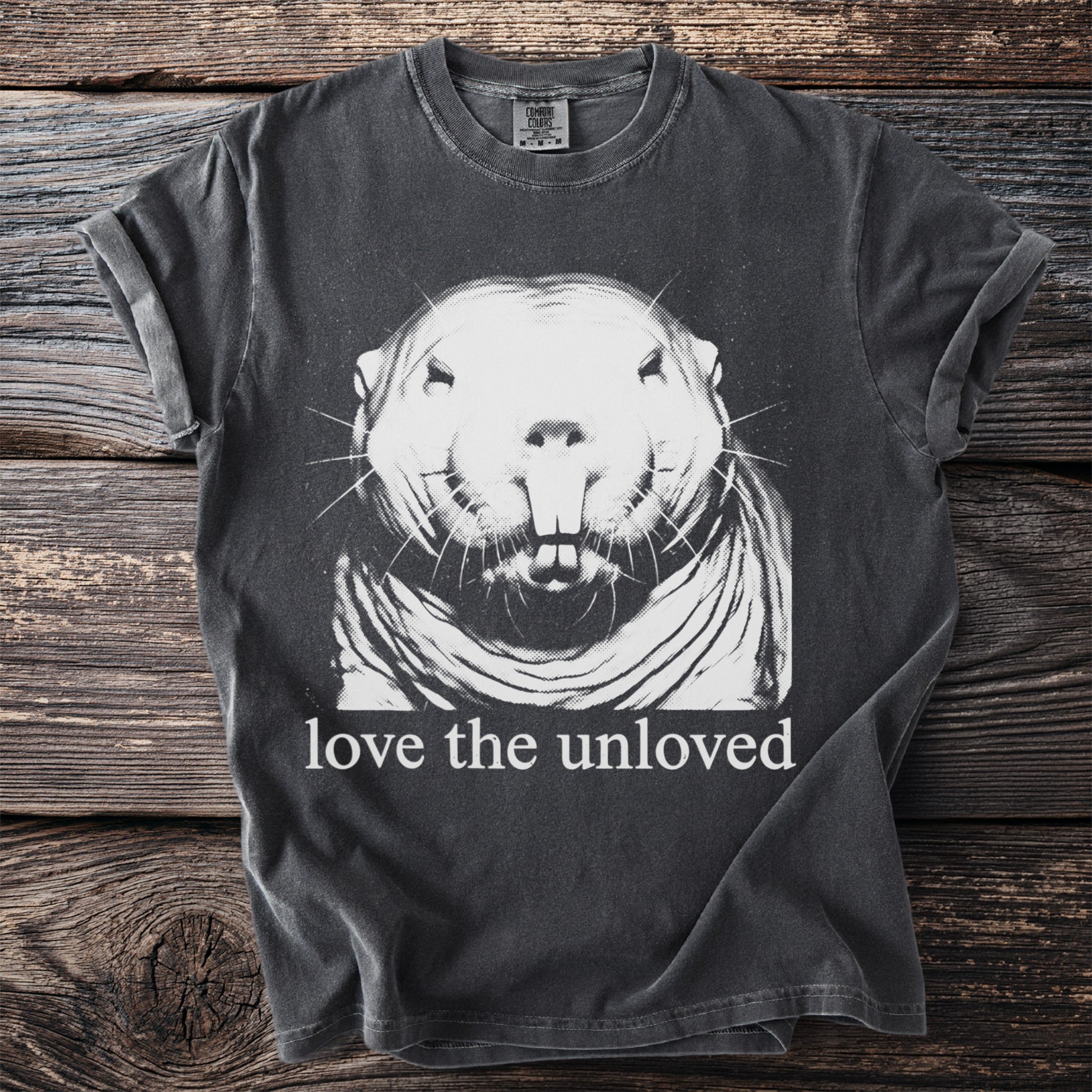 Dark gray t-shirt with a white graphic of a groundhog and the text "love the unloved".