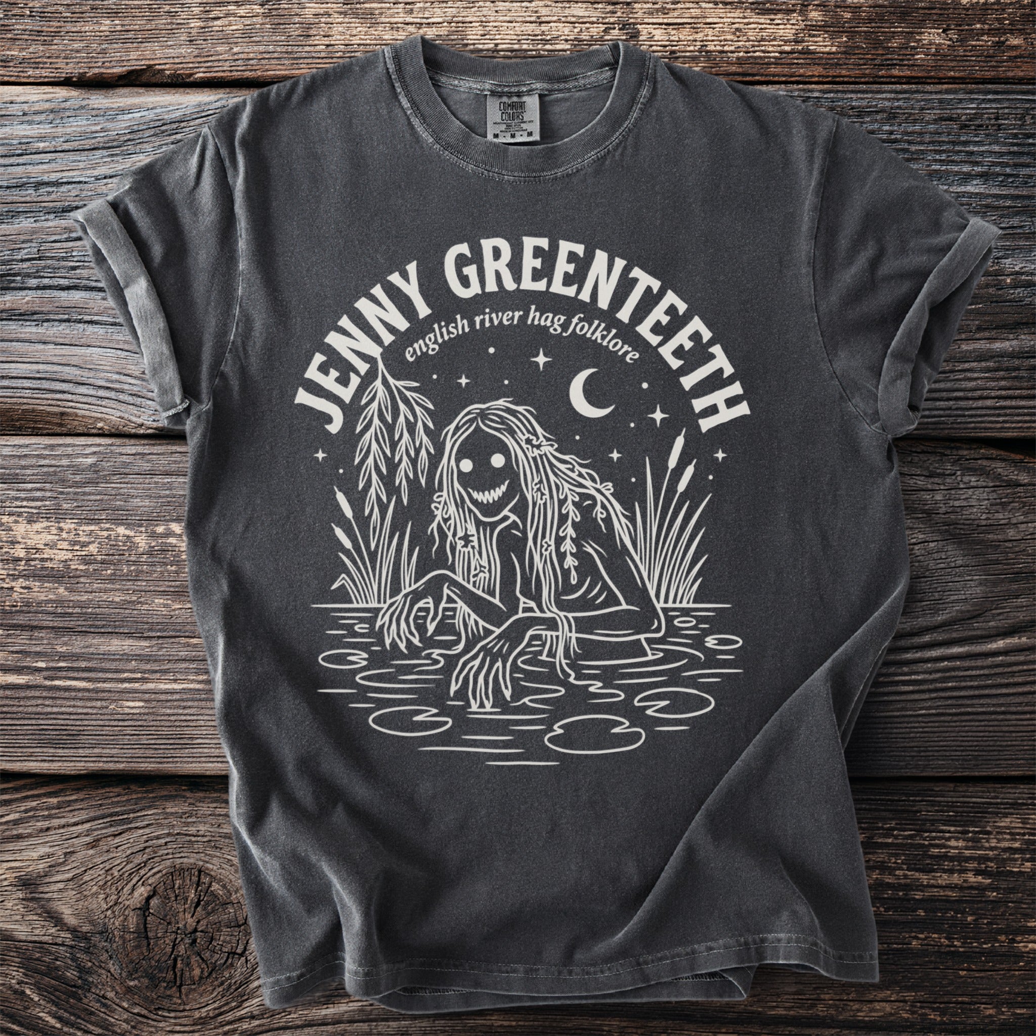 Jenny Greenteeth English river hag folklore graphic on a dark grey t-shirt.
