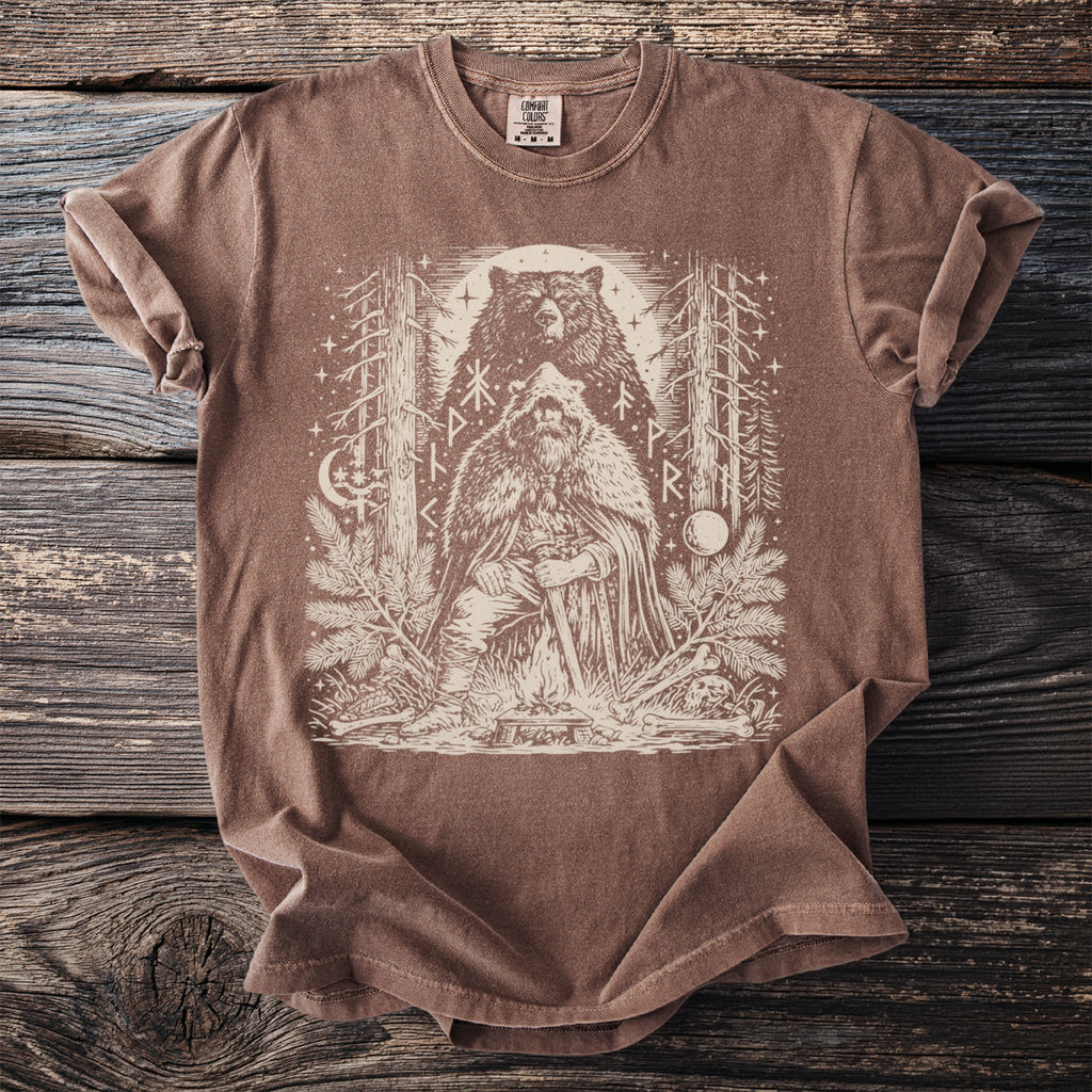 Brown t-shirt with a graphic of a Viking and a bear surrounded by trees and runes.