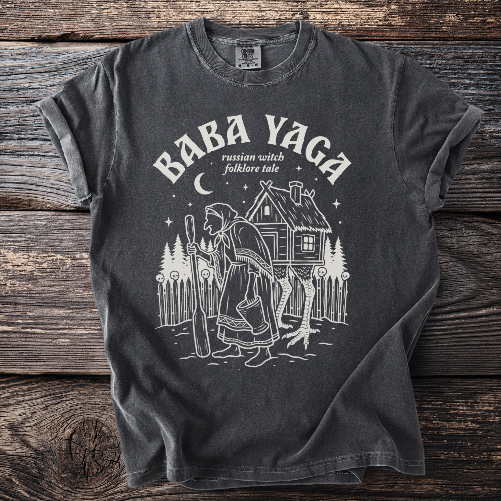 T-shirt with Baba Yaga illustration and text "russian witch folklore tale"
