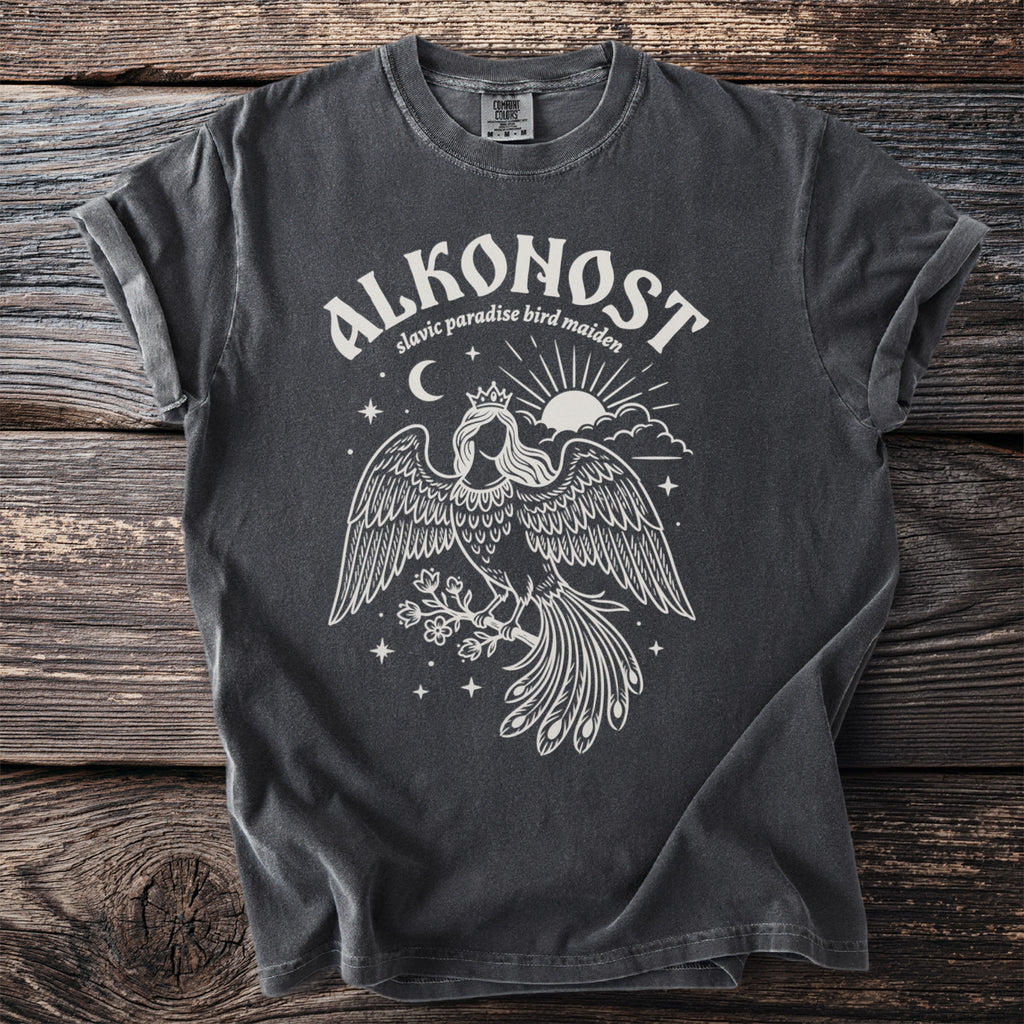 Alkonost Slavic paradise bird maiden graphic t-shirt with sun, moon, and stars.